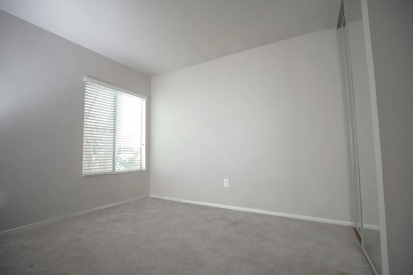 Before: Virtual staging AI turning a spare room into an office